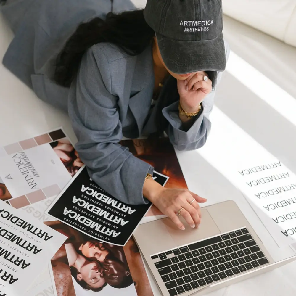 Woman working on laptop wearing Artmedica cap in Vienna, VA